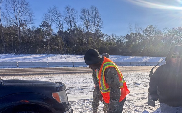 678th Air Defense Artillery Brigade vehicle-recovery team assist a stranded vehicle during Winter Storm Gianna&amp;#xA;