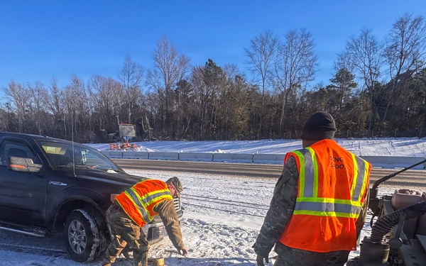 678th Air Defense Artillery Brigade vehicle-recovery team assist a stranded vehicle during Winter Storm Gianna&amp;#xA;