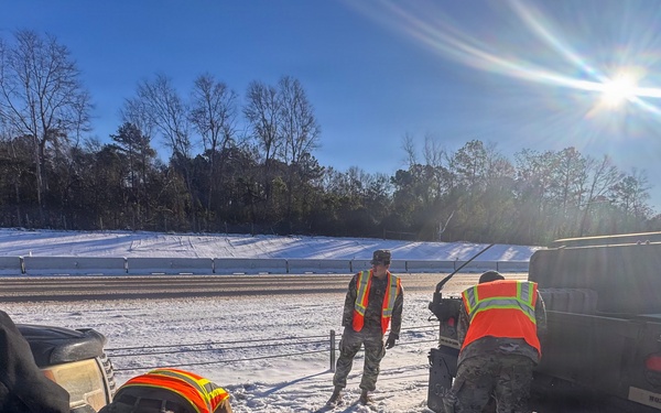678th Air Defense Artillery Brigade vehicle-recovery team assist a stranded vehicle during Winter Storm Gianna&amp;#xA;