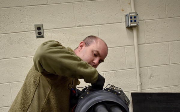 138th Aircraft Maintenance Squadron Airmen inspect F-16 Viper weaponry