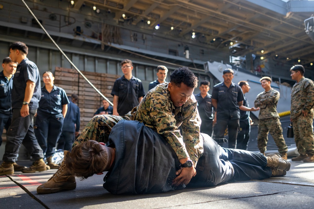 11th MEU Marines Conduct Combat Life Saver Qualification Aboard USS Comstock