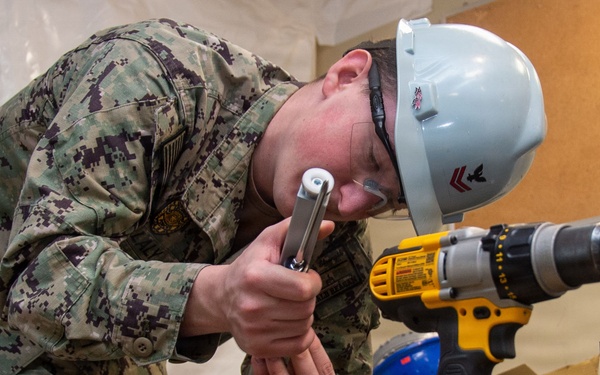 Ronald Reagan Sailors and Contractors Execute Maintenance Operations