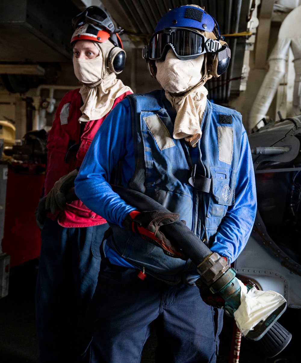U.S. Sailors Operate Firehose During a Drill