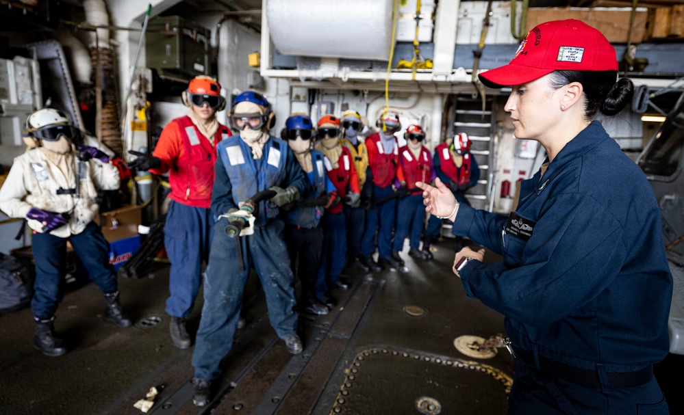 USS Gettysburg (CG-64) Sailors Briefed in The Hangar Bay
