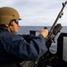 U.S. Sailor Replaces Hot Barrel of an M240B Machine Gun