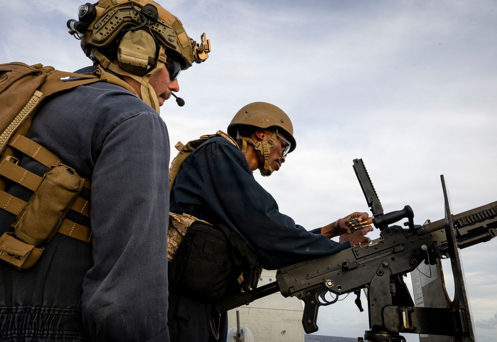 U.S. Sailor Reloads an M240B Machine Gun