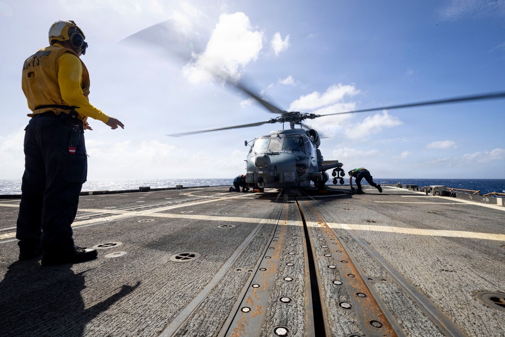 U.S. Sailors Chock and Chain an MH-60R Seahawk Helicopter