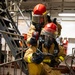 U.S. Sailors Combat a Simulated Fire During a General Quarters Drill