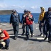 U.S. Sailors Conduct a Foreign Object Debris Walkdown on the Flight Deck