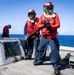U.S. Sailors man a Firefighting Hose on the Flight Deck During a Damage Control Training Evolution