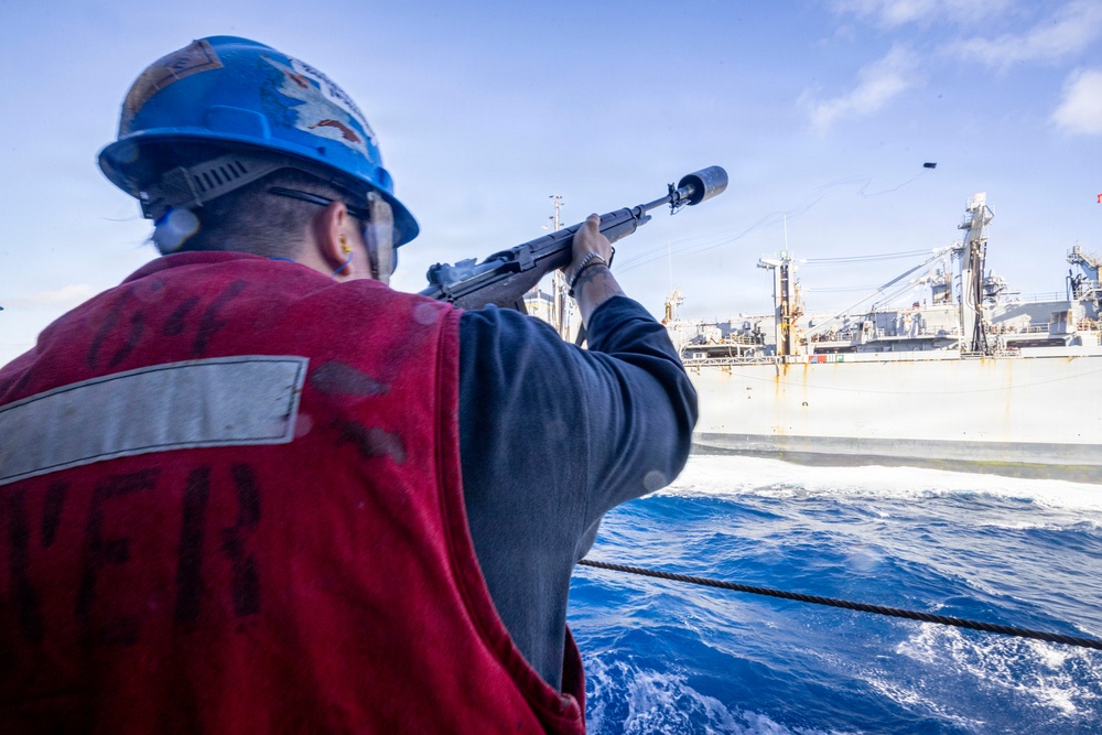 U.S. Sailor Fires a Shot Line Across the Midships