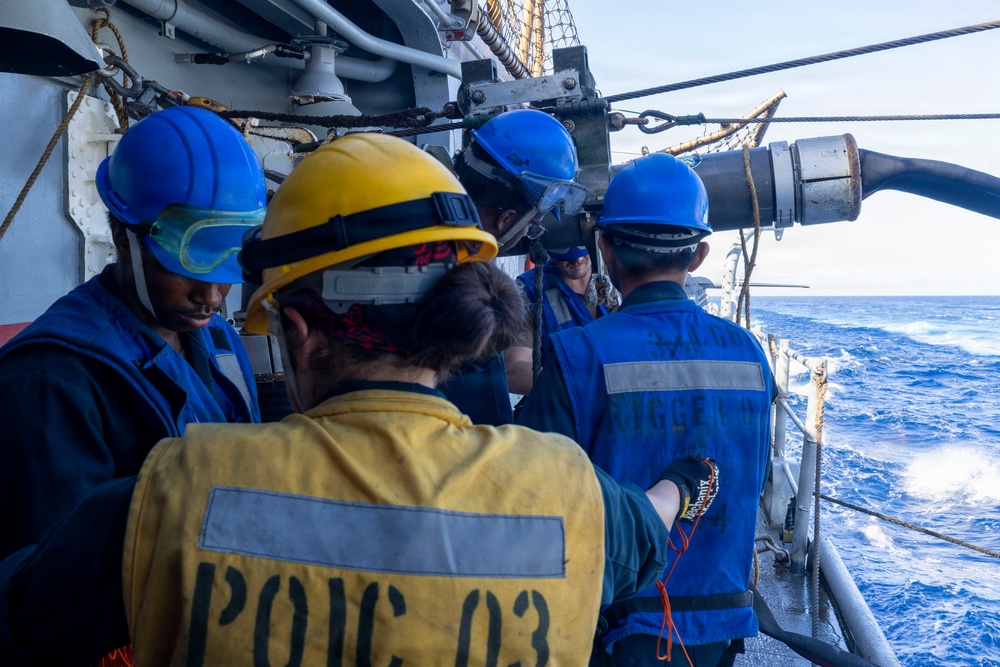 U.S. Sailors Prepare Fuel Lines From Supply-Class Fast Combat Support Ship USNS Supply (T-AOE 6) During a Replenishment-at-sea