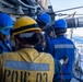 U.S. Sailors Prepare Fuel Lines From Supply-Class Fast Combat Support Ship USNS Supply (T-AOE 6) During a Replenishment-at-sea