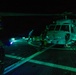 U.S. Sailors Chock and Chain an MH-60R Sea Hawk Helicopter on the Flight Deck