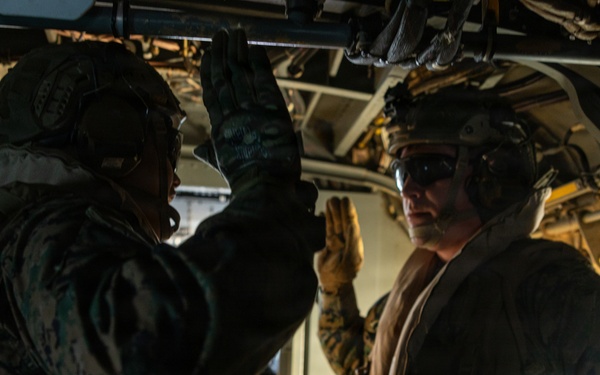 U.S. Marine with 12TH LCT Reenlists Aboard an MV-22 Osprey