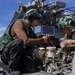 Iwo Jima Sailors Conduct Aircraft Maintenance