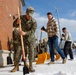 U.S. Marines with Marine Corps Base Quantico Shovel Snow for the Crossroads Elementary School