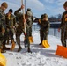 U.S. Marines with Marine Corps Base Quantico Shovel Snow for the Crossroads Elementary School