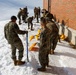 U.S. Marines with Marine Corps Base Quantico Shovel Snow for the Crossroads Elementary School