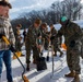 U.S. Marines with Marine Corps Base Quantico Shovel Snow for the Crossroads Elementary School