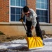 U.S. Marines with Marine Corps Base Quantico Shovel Snow for the Crossroads Elementary School
