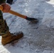 U.S. Marines with Marine Corps Base Quantico Shovel Snow for the Crossroads Elementary School