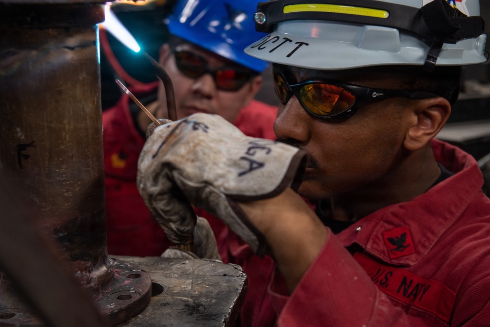 Ronald Reagan Sailors Work on Ship Components