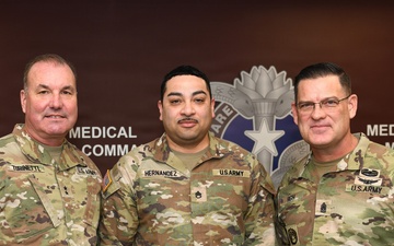 Coin presentation to Hernandez