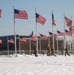 Service members clear snow at the Washington Monument