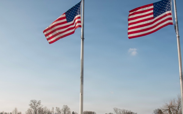 Service members clear snow at the Washington Monument