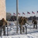 Service members clear snow at the Washington Monument