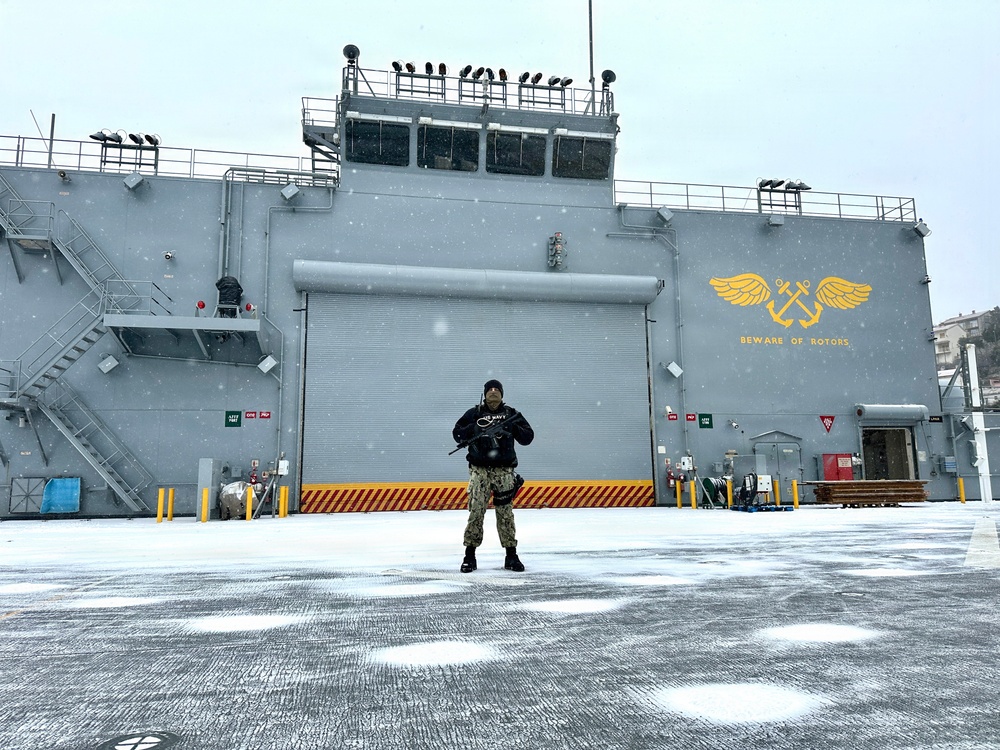 Aviation Boatswain’s Mate Third Class Petty Officer Spencer Harris stands Force Protection watch