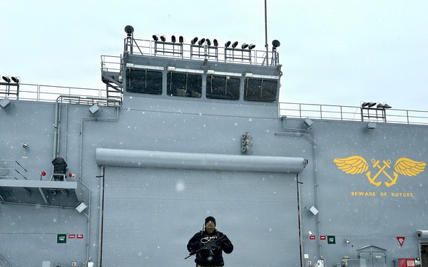 Aviation Boatswain’s Mate Third Class Petty Officer Spencer Harris stands Force Protection watch