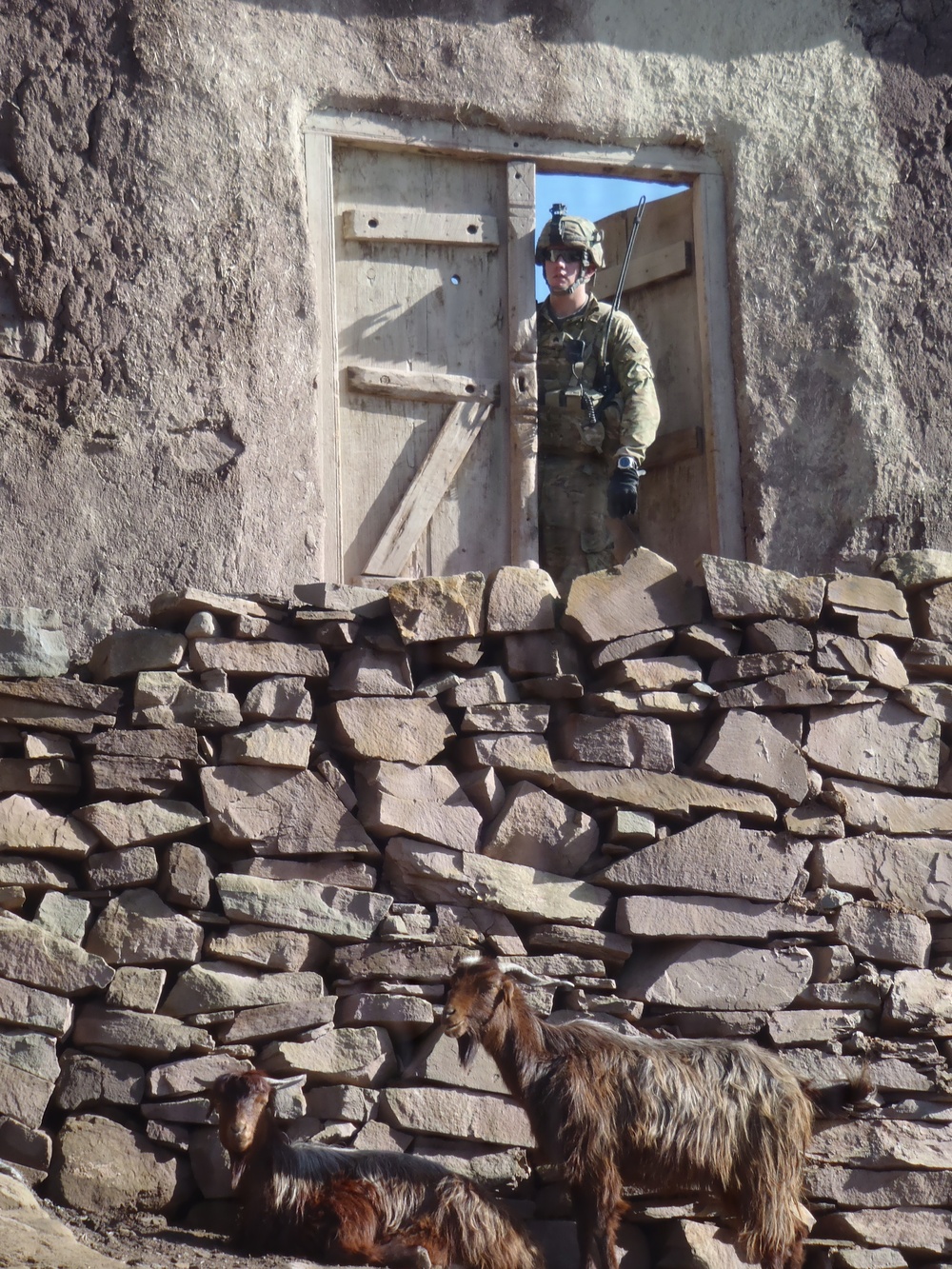 Soldier searching compound