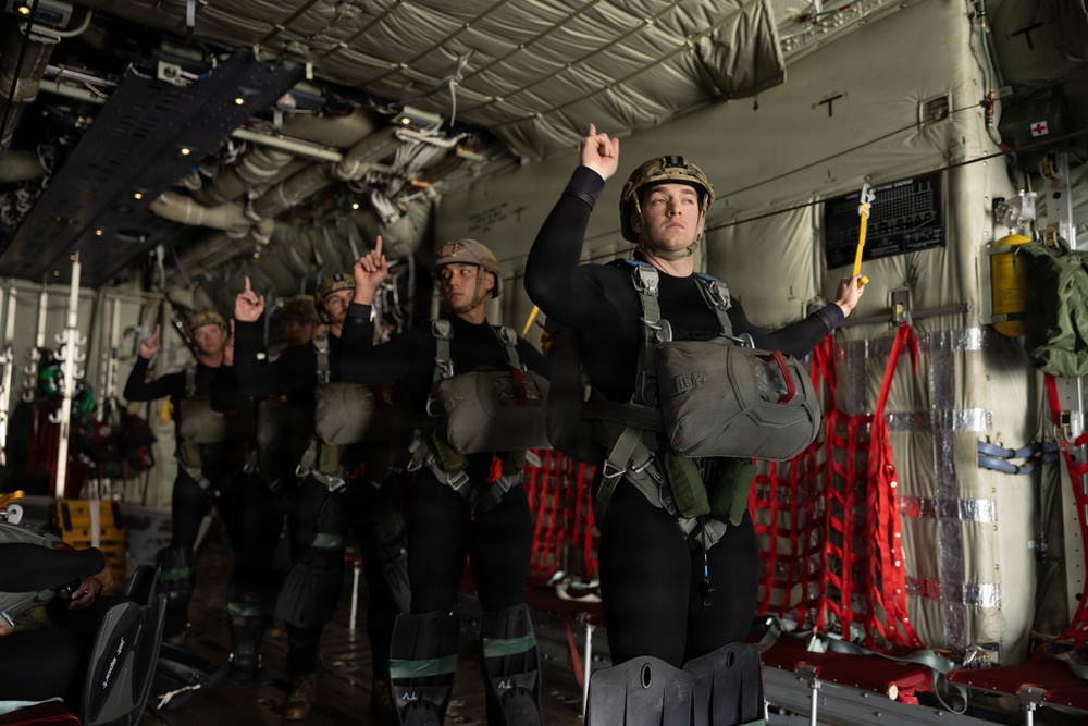 Navy EOD Mobile Unit 1 conducts KC-130J static line jump