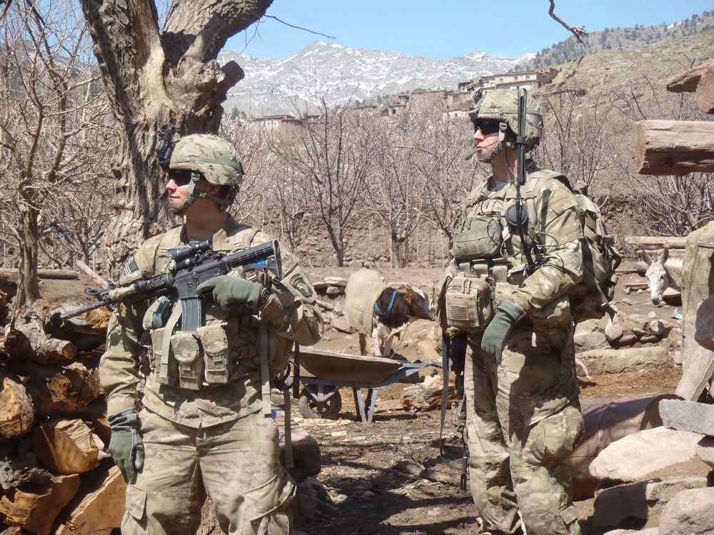 Soldiers pause in village