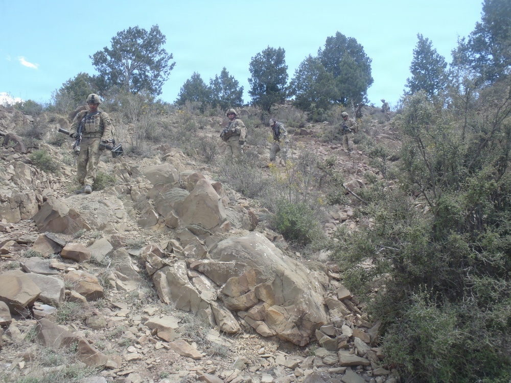 Soldiers moving down a mountain