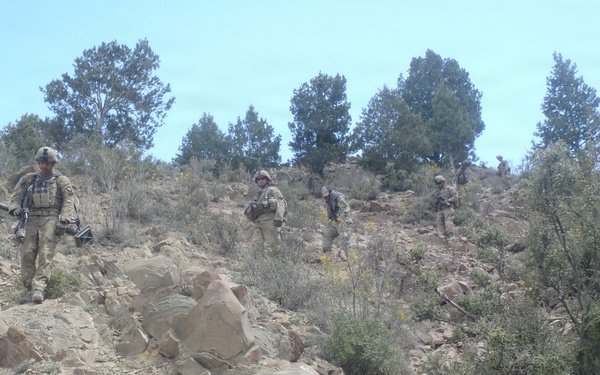 Soldiers moving down a mountain