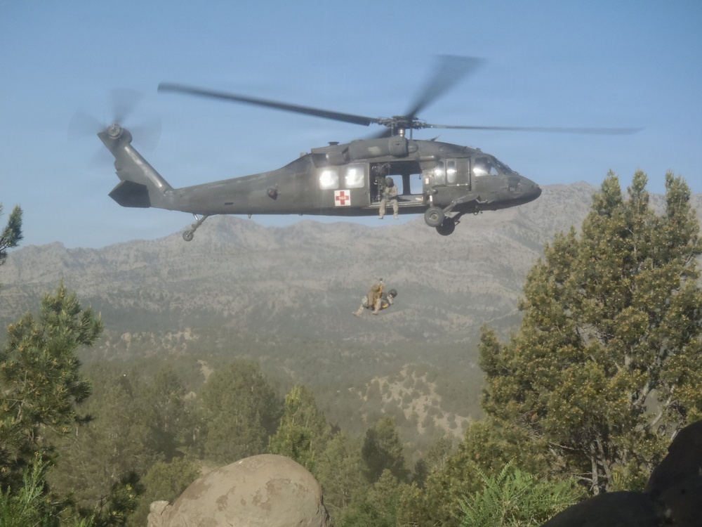 UH-60 hoists soldier