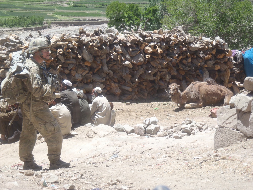 Soldier watches villagers