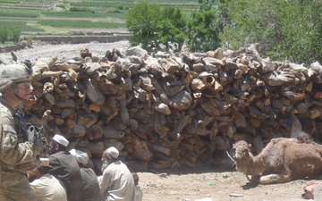 Soldier watches villagers