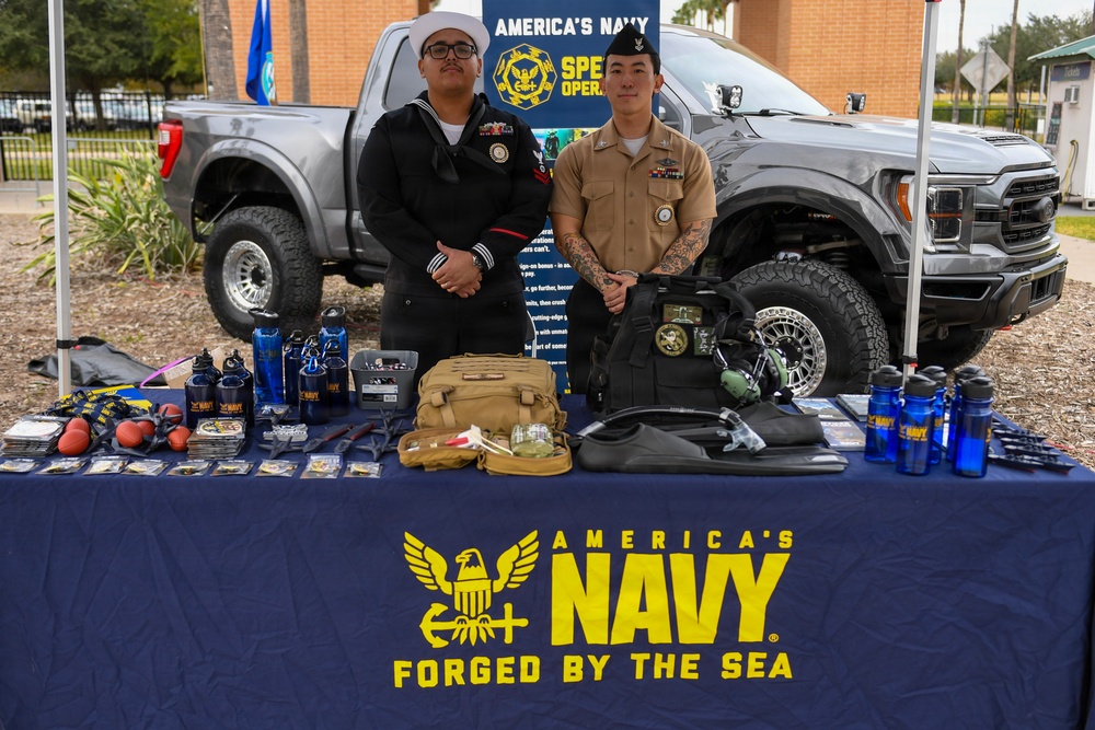 EN2 Olvera and HM2 Ahn pose for a picture at their recruiting table