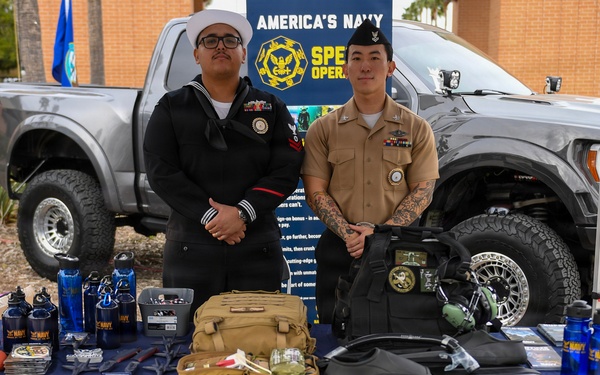 EN2 Olvera and HM2 Ahn pose for a picture at their recruiting table