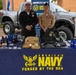 EN2 Olvera and HM2 Ahn pose for a picture at their recruiting table