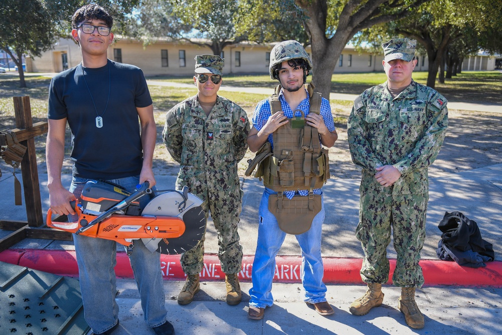 NMCB 133 “SeaBees” pose for a picture with students from the Pat McNallen Performing Arts Center