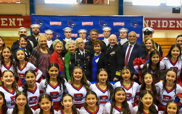 Admiral Faehnle visits Barrientes Middle School during school hours to present a challenge coin to Sargent Barrientes