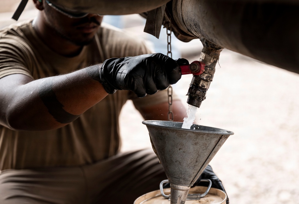 POL Airmen conduct fuel sampling and maintenance operations