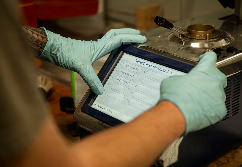 POL Airmen conduct fuel sampling and maintenance operations