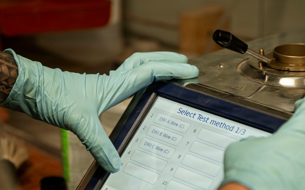 POL Airmen conduct fuel sampling and maintenance operations