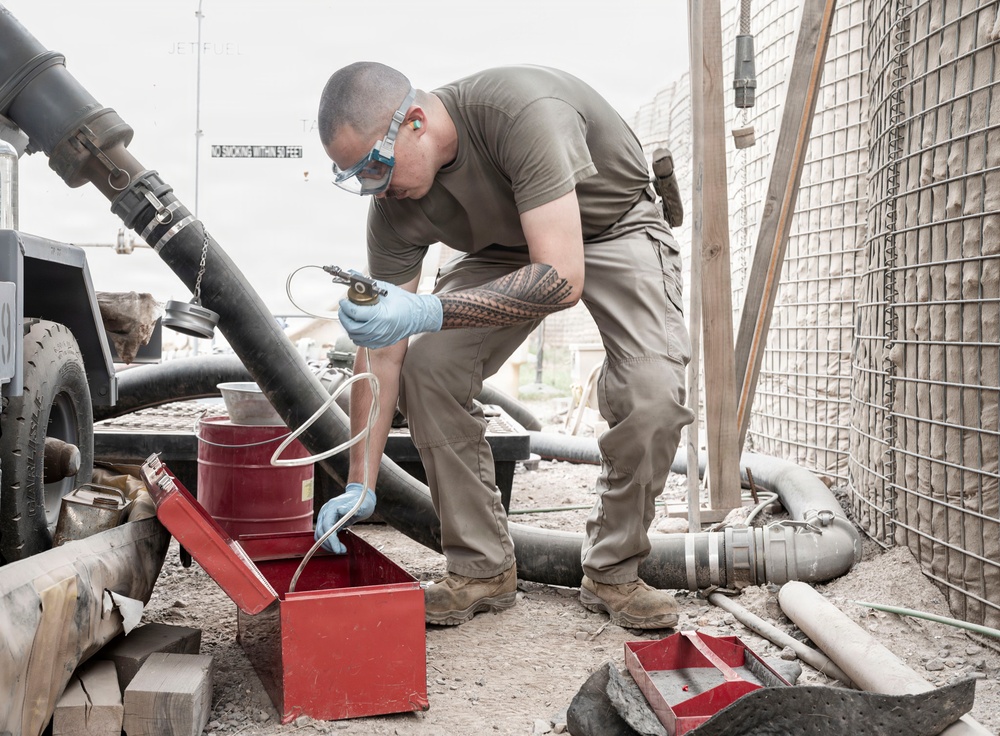 POL Airmen conduct fuel sampling and maintenance operations